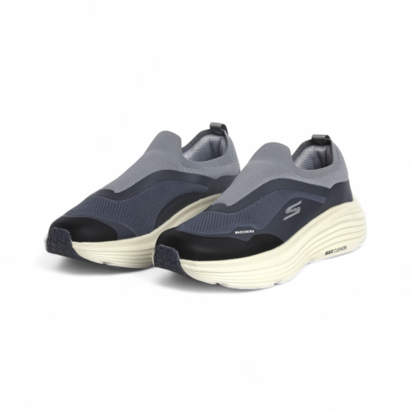 Gray and black sneakers with white soles on a white background